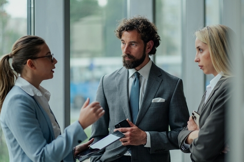 Outsourced CFO Services team discussing financial strategy and operational decisions in a professional office setting.