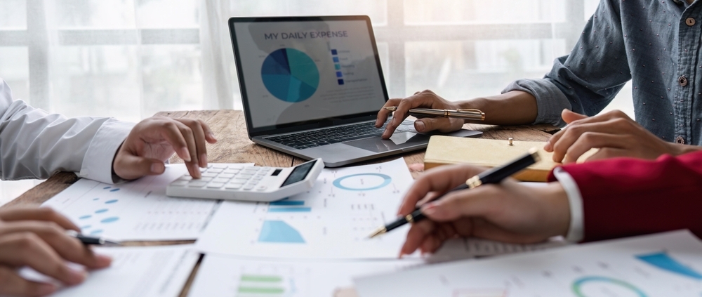 Business owner reviewing a strategic financial planning report with a fractional CFO advisor in Guelph Ontario