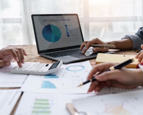 Business owner reviewing a strategic financial planning report with a fractional CFO advisor in Guelph Ontario