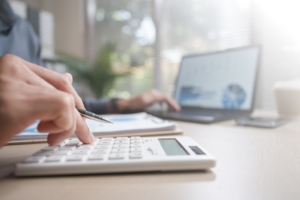 Growing business team meeting with a fractional CFO advisor in Waterloo Ontario to discuss financial leadership