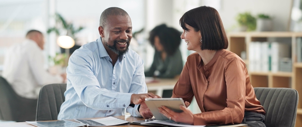 Growing business owner reviewing financial statements for bank loans with a fractional CFO advisor in Guelph Ontario