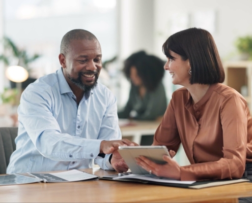 Growing business owner reviewing financial statements for bank loans with a fractional CFO advisor in Guelph Ontario