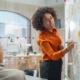Business owner facing the challenges of scaling a business while reviewing financial reports with a fractional CFO advisor in Guelph Ontario